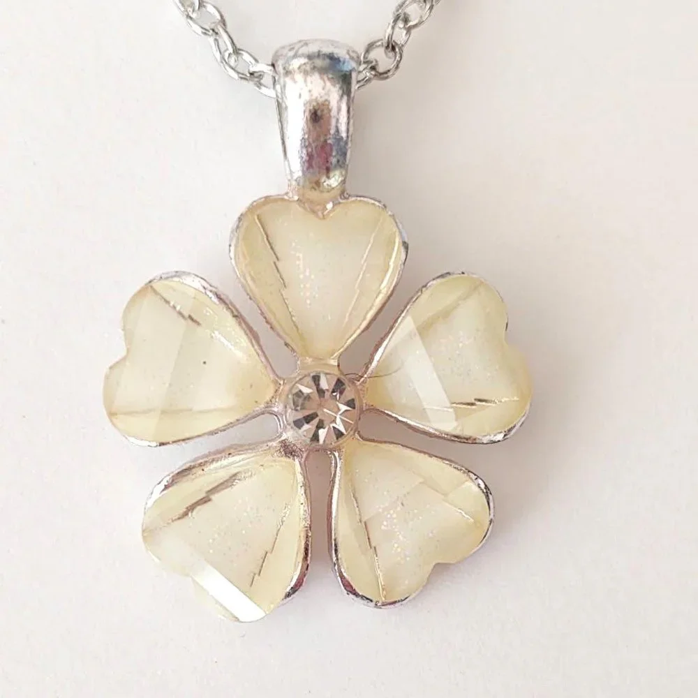 Cream flower pendant necklace with cz center and silver accents